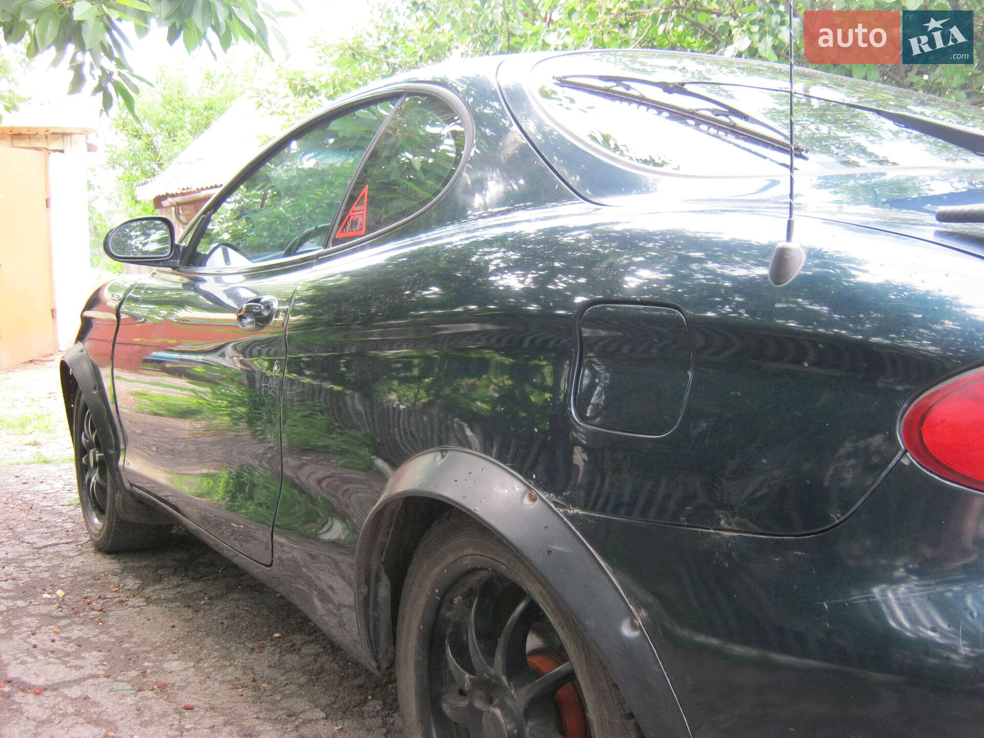Hyundai Tiburon 1998 VIN KMHJG34F0WU112844 фото оголошення 4 з 21