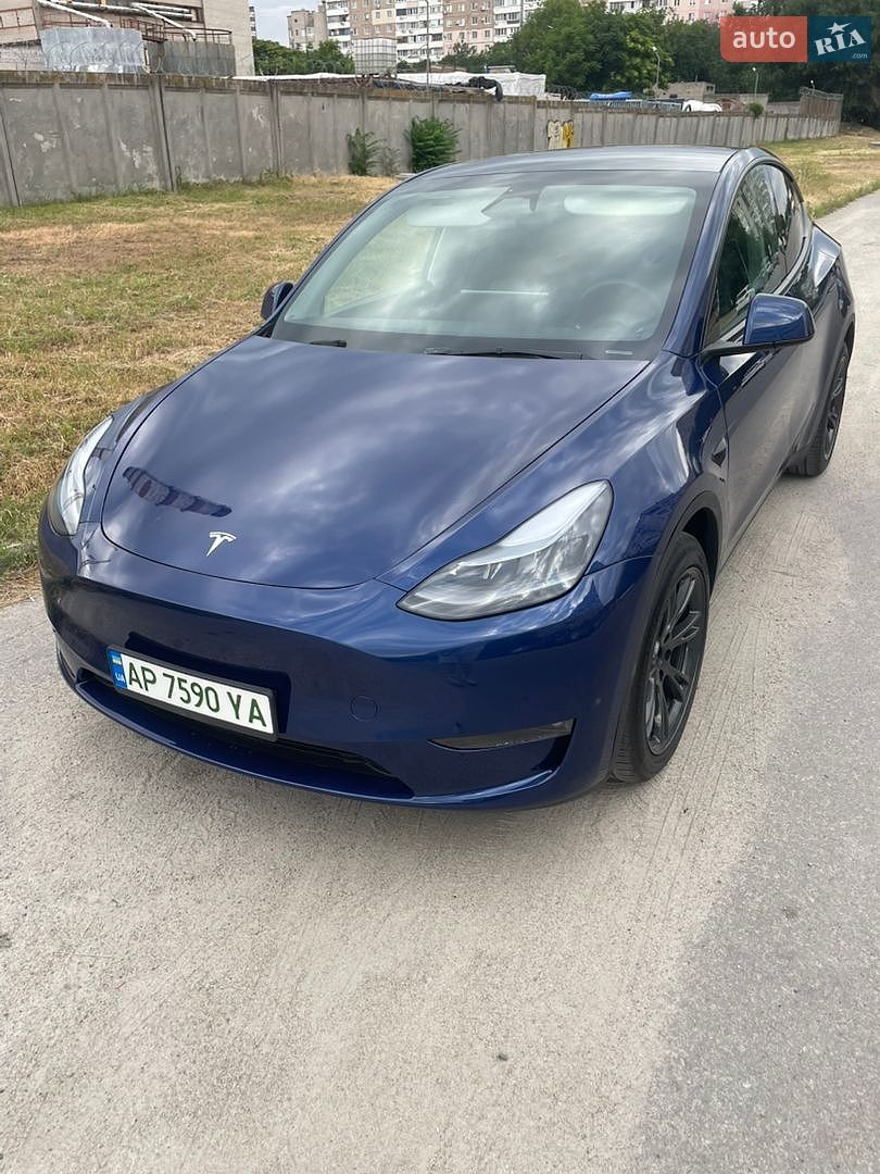 Tesla Model Y 2024 VIN 7SAYGAEE4RF202351 фото оголошення 2 з 21