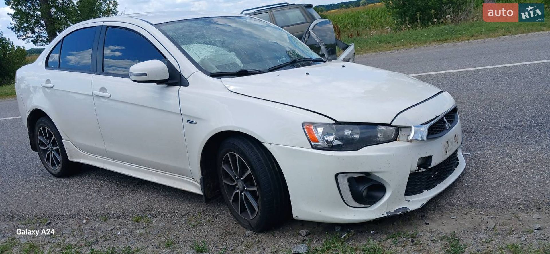 Mitsubishi Lancer 2016 VIN JA32U2FUXHU004823 фото оголошення 2 з 10