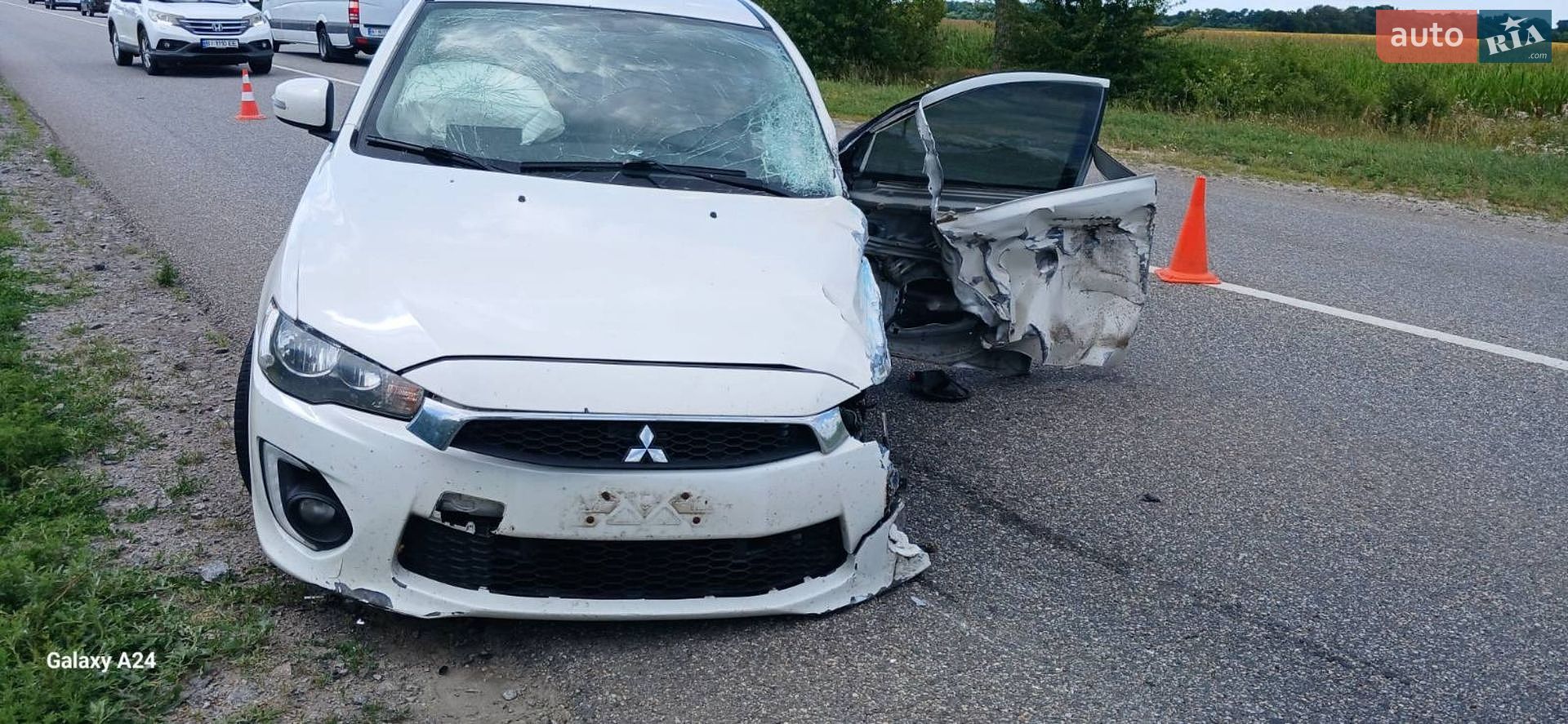 Mitsubishi Lancer 2016 VIN JA32U2FUXHU004823 фото оголошення 7 з 10