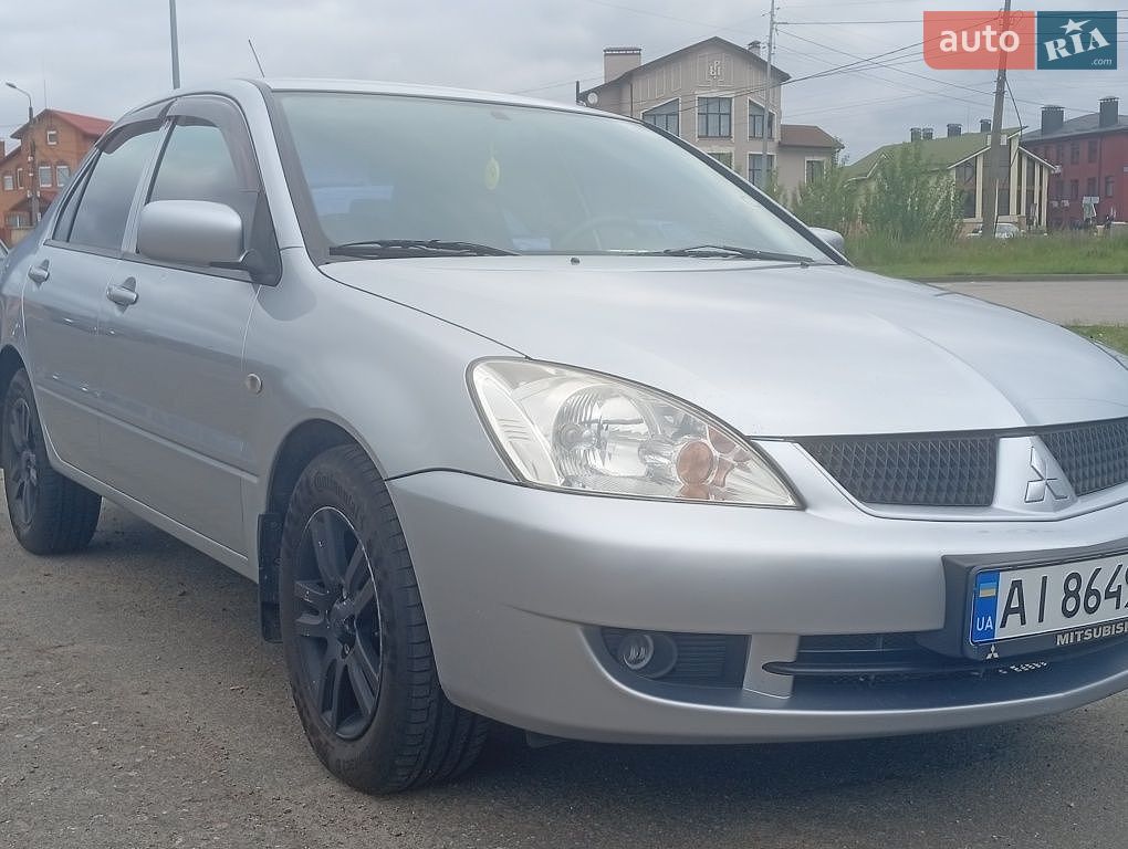 Mitsubishi Lancer 2011 VIN JMYSRCS3ABU000441 фото оголошення 7 з 18