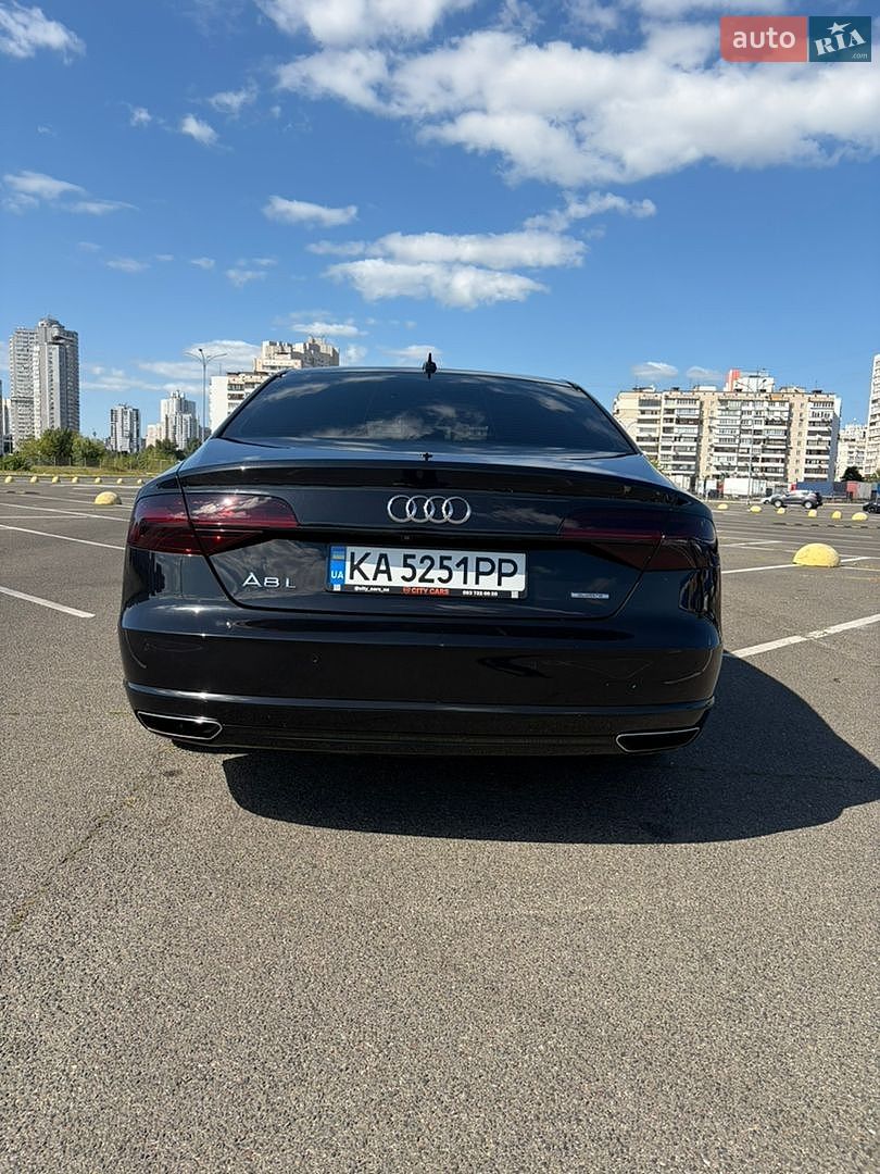 Audi A8 2014 VIN WAU3GAFD9FN028199 фото оголошення 8 з 16
