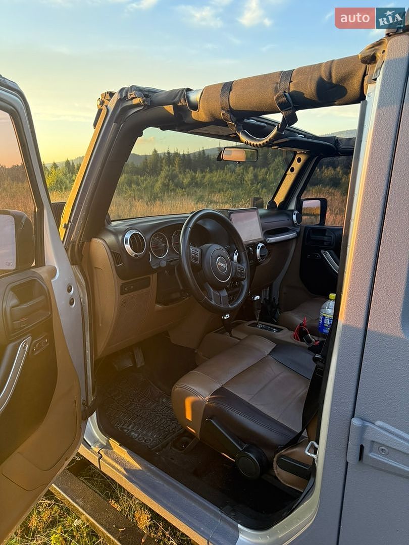 Jeep Wrangler 2011 VIN 1C4HJWFGXCL104263 фото оголошення 13 з 15