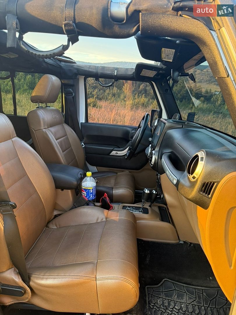 Jeep Wrangler 2011 VIN 1C4HJWFGXCL104263 фото оголошення 14 з 15