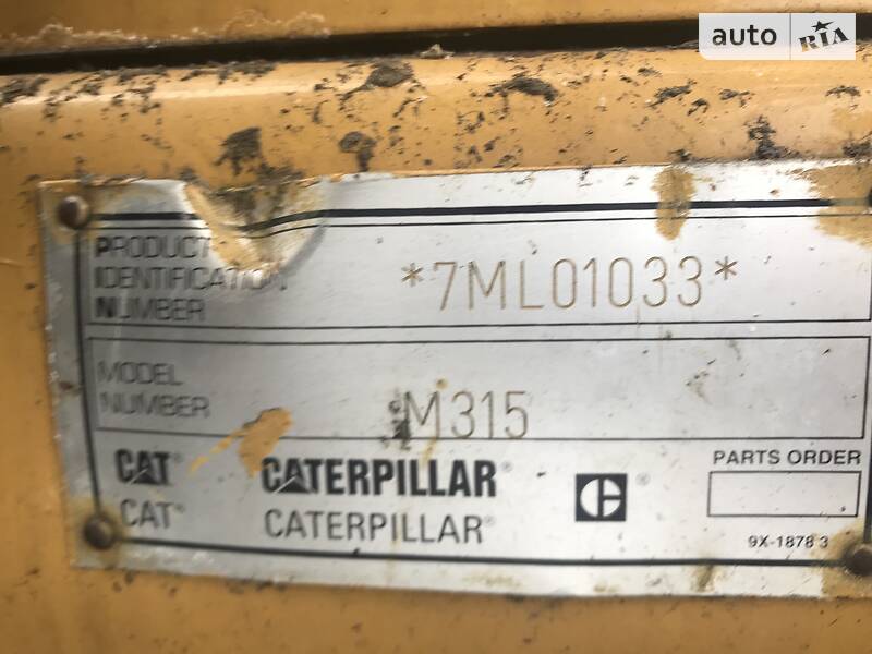 Колесный экскаватор Caterpillar 315 2001 в Косове