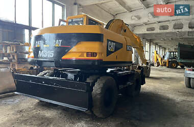 Колесный экскаватор Caterpillar 315 2001 в 