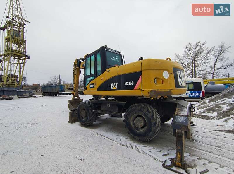 Колесный экскаватор Caterpillar 316 2009 в Николаеве