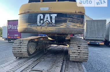 Екскаватор навантажувач Caterpillar 318 2005 в 