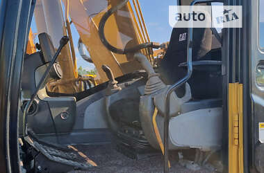 Гусеничный экскаватор Caterpillar 320 2009 в 
