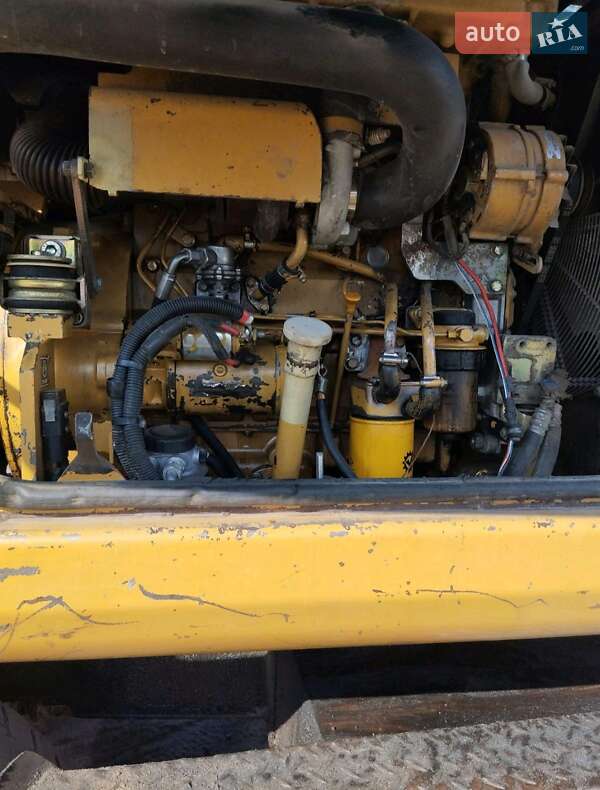 Екскаватор навантажувач Caterpillar M312 2002 в Житомирі