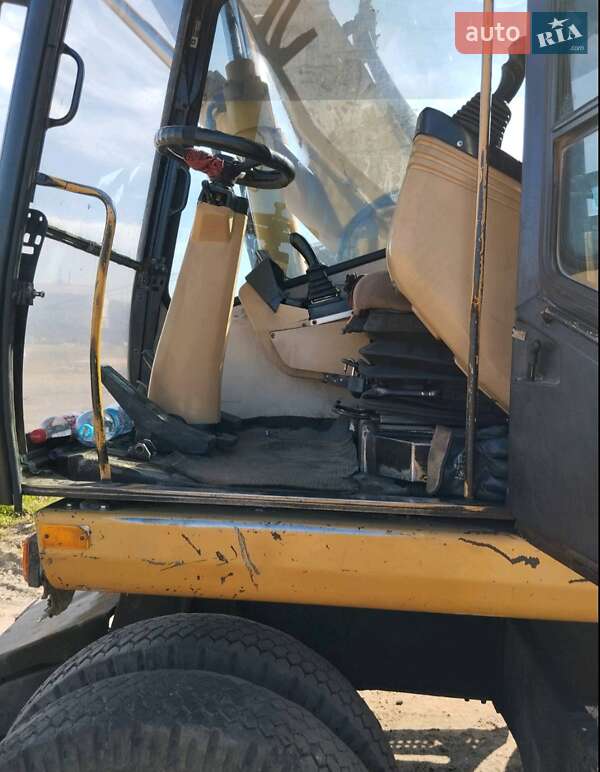 Екскаватор навантажувач Caterpillar M312 2002 в Житомирі