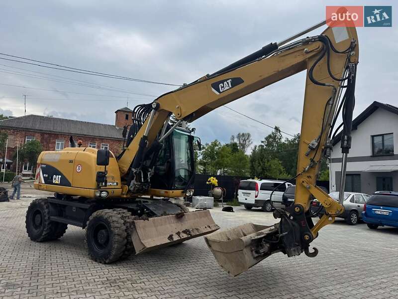 Колесный экскаватор Caterpillar M313 2012 в Долине