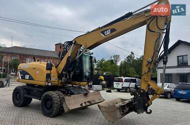 Колесный экскаватор Caterpillar M313 2012 в 