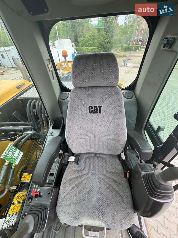 Колесный экскаватор Caterpillar M313 2012 в Долине