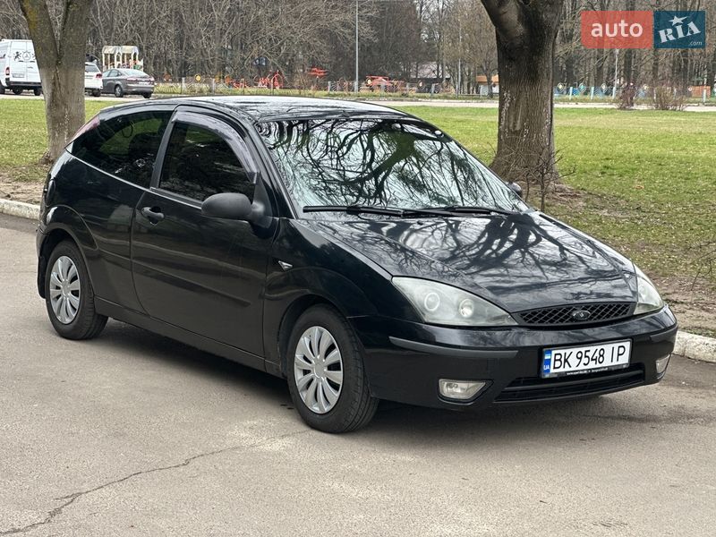 2005 Ford Focus, VIN 3FAFP31N75R124698:plate — фото 1 (autoria)
