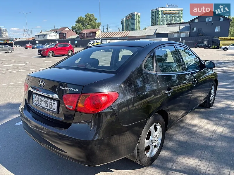 Hyundai Elantra 2010 VIN KMHDU41DBAU111223 фото оголошення 4 з 52