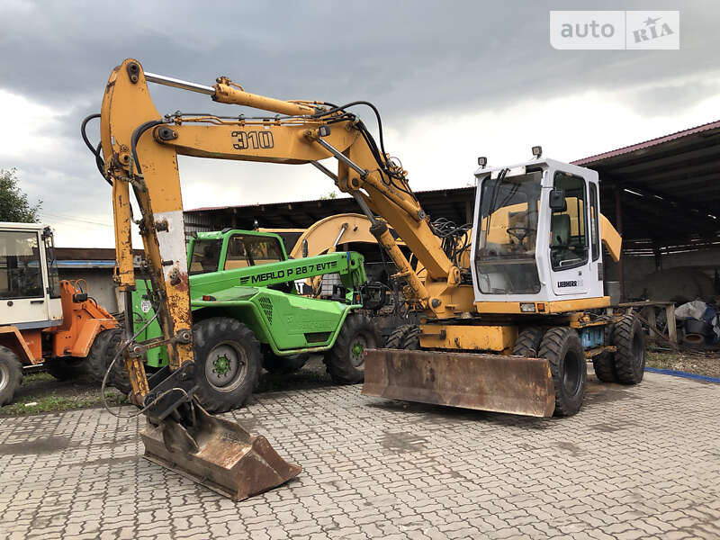 Колесный экскаватор Liebherr 311 1996 в Калуше