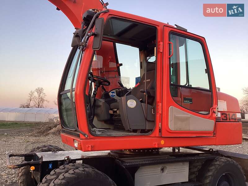 Колесный экскаватор Liebherr 314 2008 в Виноградове