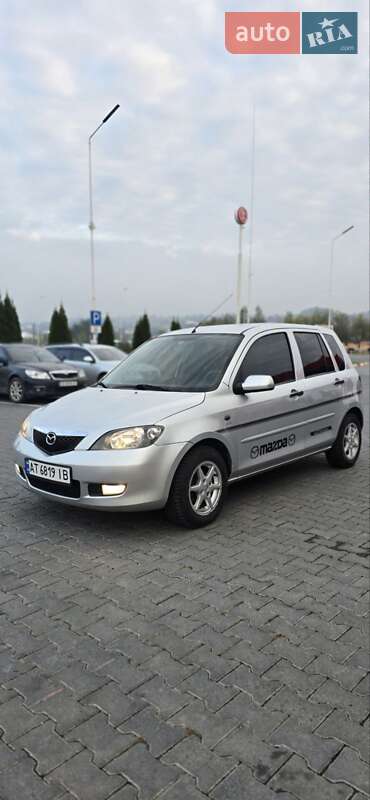 2005 Mazda 2, VIN JMZNEAWPJN5B47788:plate — фото 1 (autoria)