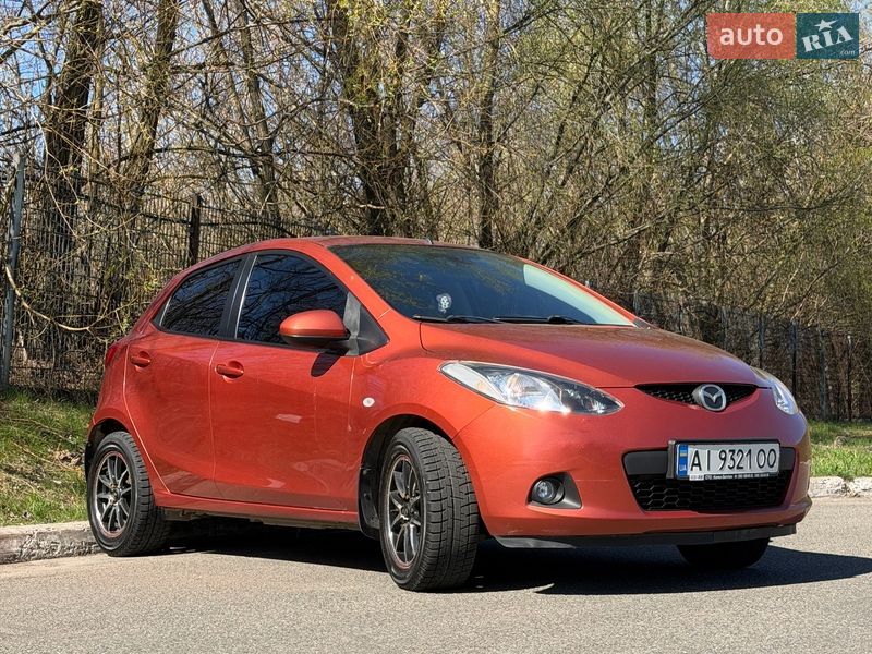 2009 Mazda 2, VIN JMZDE145500230906:plate — фото 1 (autoria)