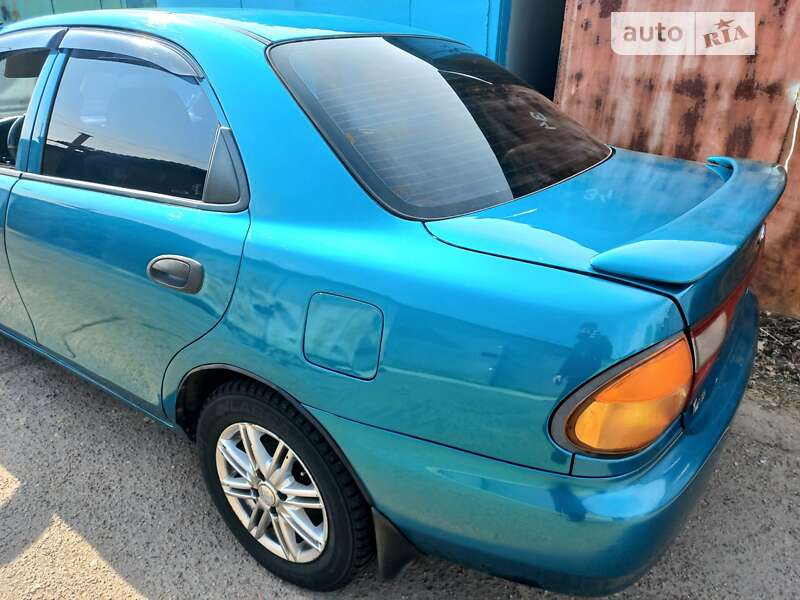 Седан Mazda 323 1998 в Одесі фото 11 Седан Mazda 323 1998 в Одесі