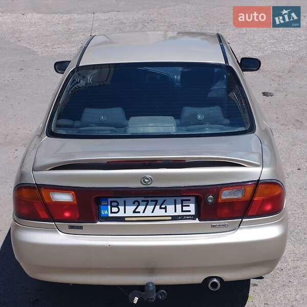 Седан Mazda 323 1995 в Кременчуці фото 4 Седан Mazda 323 1995 в Кременчуці