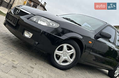 Хэтчбек Mazda 323 2003 в 