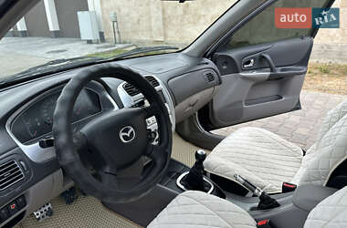 Хэтчбек Mazda 323 2003 в 
