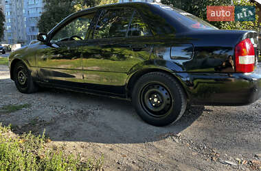 Седан Mazda 323 1999 в 
