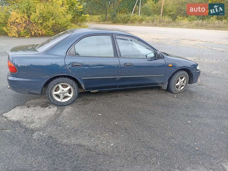 Седан Mazda 323 1995 в Богуславе фото 4 Седан Mazda 323 1995 в Богуславе