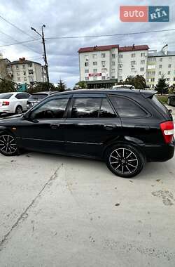 Хэтчбек Mazda 323 2001 в  фото 11 Хэтчбек Mazda 323 2001 в