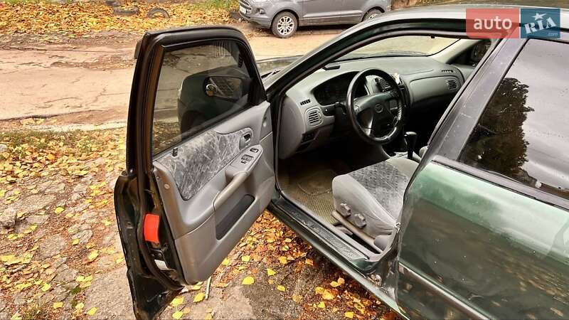 Хетчбек Mazda 323 1999 в Києві фото 11 Хетчбек Mazda 323 1999 в Києві