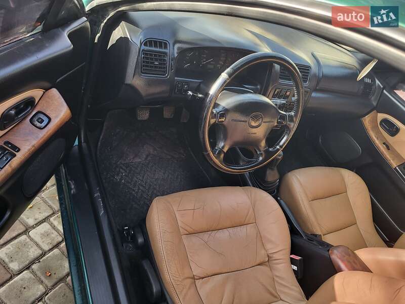 Хетчбек Mazda 323 1998 в Подільську фото 3 Хетчбек Mazda 323 1998 в Подільську