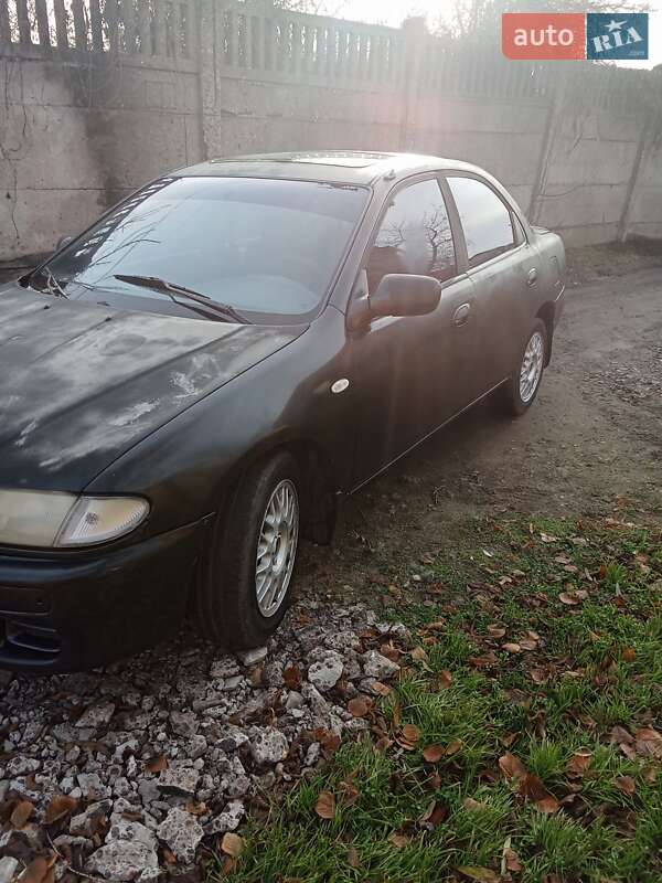 Седан Mazda 323 1995 в Одесі фото 11 Седан Mazda 323 1995 в Одесі