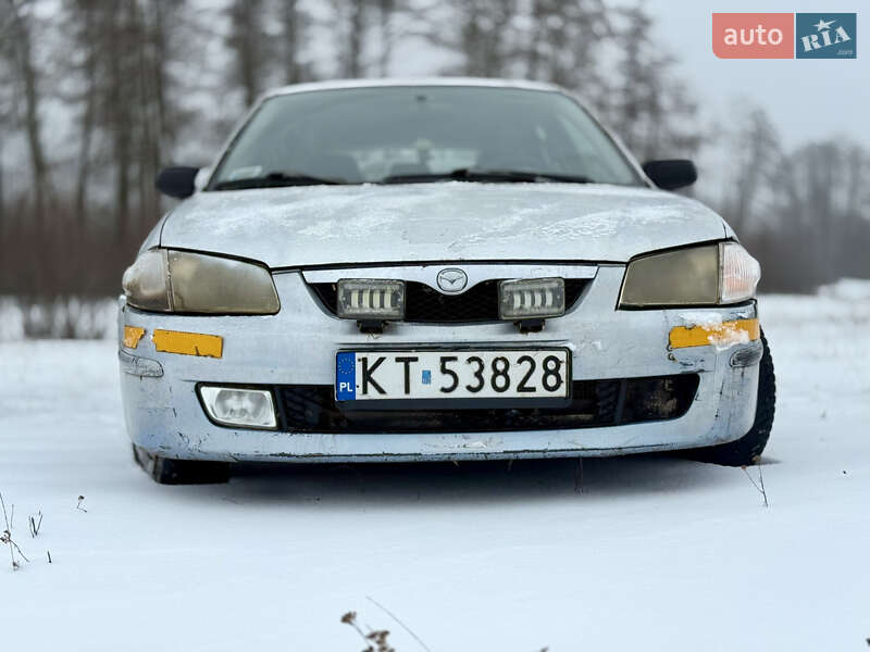 Хэтчбек Mazda 323 1999 в Калиновке фото 2 Хэтчбек Mazda 323 1999 в Калиновке