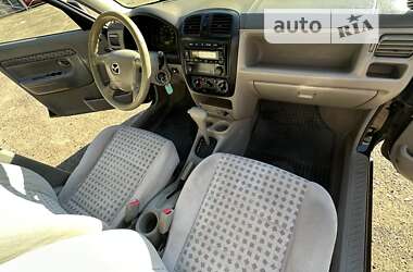 Хэтчбек Mazda Demio 2002 в 