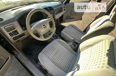 Хэтчбек Mazda Demio 2002 в 