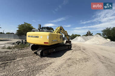 Екскаватор навантажувач New Holland E 305 2013 в 
