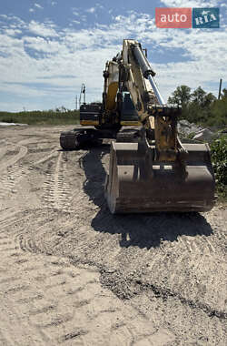 Екскаватор навантажувач New Holland E 305 2013 в 
