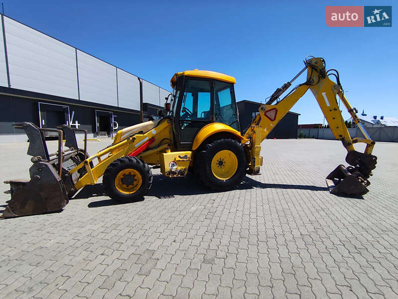 Екскаватор навантажувач New Holland LB95B-4PT 2003 в Львові