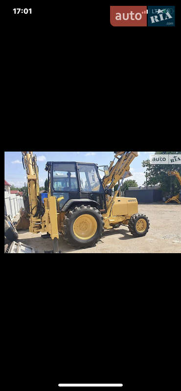 Экскаватор погрузчик New Holland LB 1995 в 