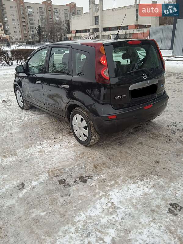 2011 Nissan Note, VIN SJNFAAE11U2129441:plate — фото 1 (autoria)
